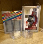 Vintage 1984 Tasco 300 Power Microscope & 1985 24 Prepared Slides + Dishes Used. Price: $34.99.